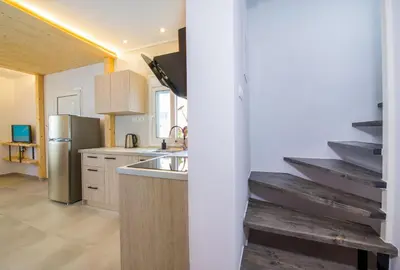 a kitchen with a sink and a refrigerator at 
