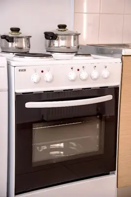 a white oven with two pots on top of it at Nikis Apartment 2 in Chania Town
