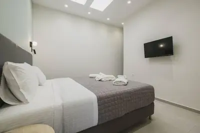 a bedroom with a bed with two towels on it at Peris 3 - Central Apt near Old Town - AC, Wifi in Chania Town