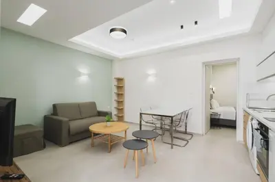 a living room with a couch and a table at Peris 3 - Central Apt near Old Town - AC, Wifi in Chania Town