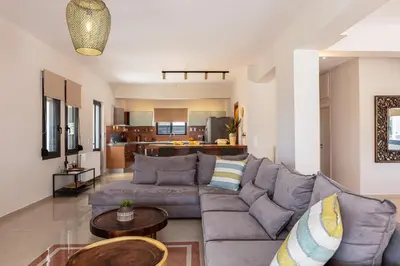 a living room with a couch and a table at Artemisia Residence in Chania Town