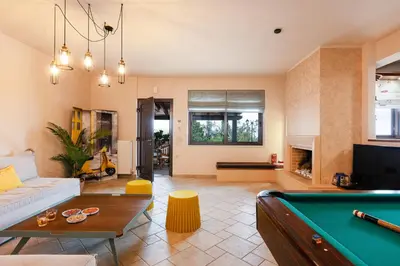 a living room with a pool table at Villa Golden Hill in Chania Town
