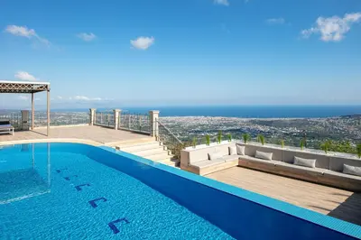 a swimming pool with a view of the ocean at Villa Golden Hill in Chania Town