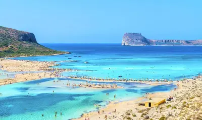 a group of people on a beach in the water at Cretan Kera Villa Heated Pool in Kerá