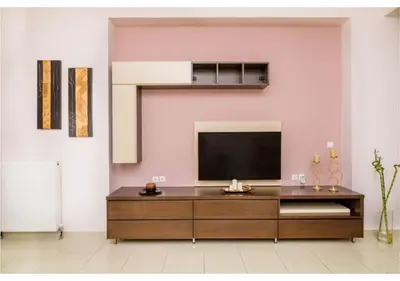 a living room with a flat screen tv on a wall at Andronikis House in Pithárion