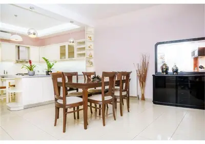 a kitchen and dining room with a table and chairs at Andronikis House in Pithárion