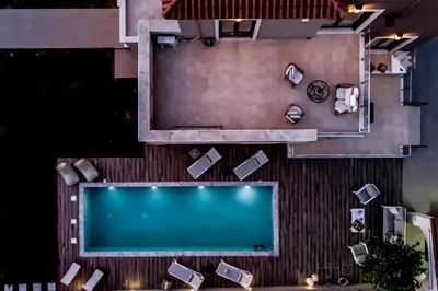 an overhead view of a swimming pool in a building at Villa Pervoli in Varípetron