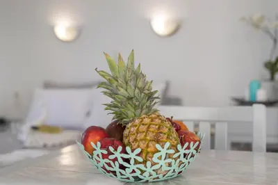 a bowl of fruit sitting on a table at Kristall Suites in Stalos
