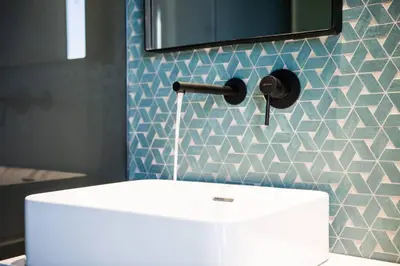 a bathroom with a white sink and a mirror at House 8 - In the Heart of Venetian town w. Parking in Chania Town