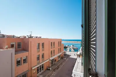 a view from a window of a street with buildings at House 8 - In the Heart of Venetian town w. Parking in Chania Town
