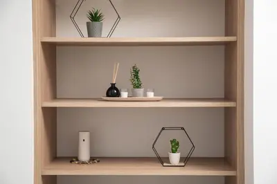 a wooden shelf with potted plants on it at Aphrodite Apartments in Kalyves