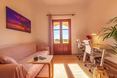 a living room with a couch and a table at Liviko Beach Apartments - only adults in Frangokastello