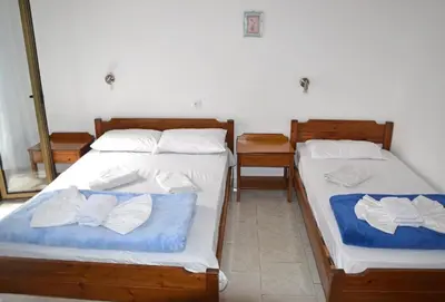 two beds sitting next to each other in a room at Orthi Ammos in Frangokastello