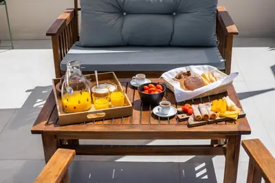 a coffee table with a tray of food on a bench at Villa Oliveto in Tavronitis