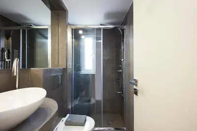 a bathroom with a shower and a sink and a toilet at Chrissula apt Homeleader in Chania Town