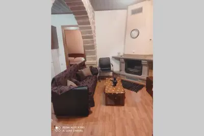 a living room with a couch and a table at Georgia's Village House in Kaláthenai