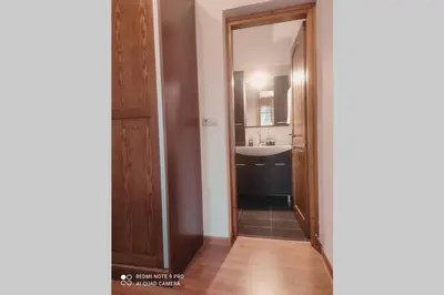 a bathroom with a sink and a mirror at Georgia's Village House in Kaláthenai