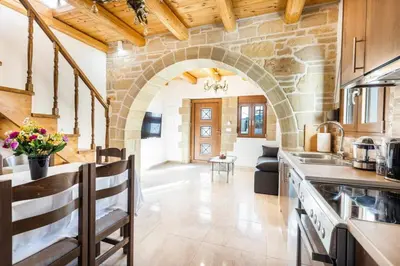 an open kitchen with an archway in a building at Platania's Paradise in Chania Town
