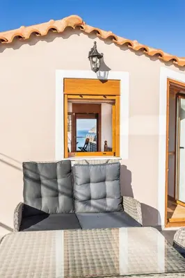 a couch in a room with a mirror at Platania's Paradise in Chania Town