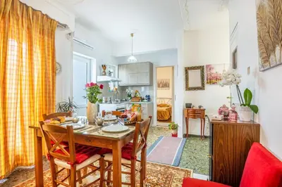 a kitchen and dining room with a table and chairs at Katerina's Apartment in Chania Center in Chania Town