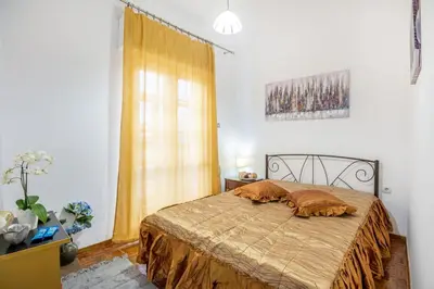 a bedroom with a bed with two pillows on it at Katerina's Apartment in Chania Center in Chania Town