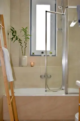 a bathroom with a shower with a bath tub at Chania Sweet Apts in Chania Town