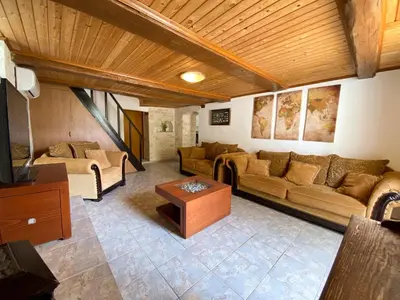 a living room with a couch and a table at Pulchra Campis,Private Pool,Wifi,Parking in Nerokoúros