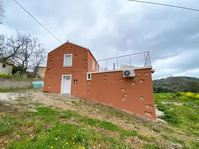 a brick building on top of a hill at Pulchra Campis,Private Pool,Wifi,Parking in Nerokoúros