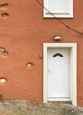 a white door in the side of a building at Pulchra Campis,Private Pool,Wifi,Parking in Nerokoúros