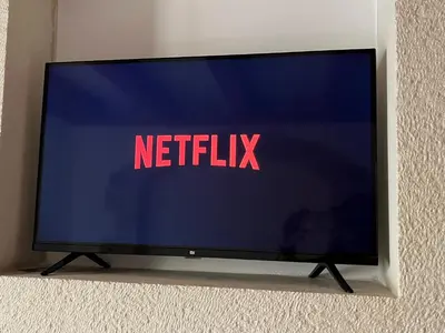 a television with the netflix sign on the screen at Casa Livieres in Chania Town