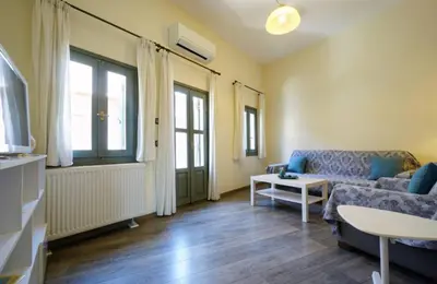 a living room with a couch and a table at Character House in the Heart of Chania Old town in Chania Town