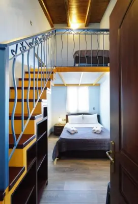 a bedroom with a bunk bed and a staircase at Character House in the Heart of Chania Old town in Chania Town