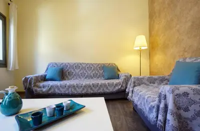 a living room with a couch and a table at Character House in the Heart of Chania Old town in Chania Town