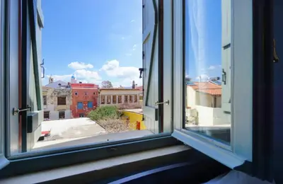 an open window with a view of a city at Character House in the Heart of Chania Old town in Chania Town