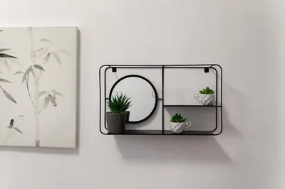 a mirror hanging on a wall with two potted plants at Just Creta Sea View apartment in Chania Town