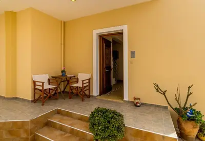 a living room with a couch and a table at Amphitrite Beach House in Chania Town