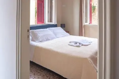 a bedroom with a bed with two towels on it at 4 Guests - Veneris Residence Apartment in Chania in Chania Town