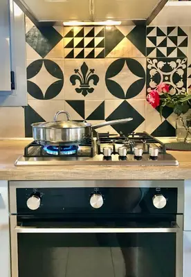 a kitchen stove with a pot on top of it at Villa Elena - Private Villa in the heart of nature in Chania Town