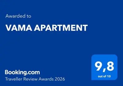 a blue sign with the words vamana apartment at VAMA APARTMENT in Plataniás