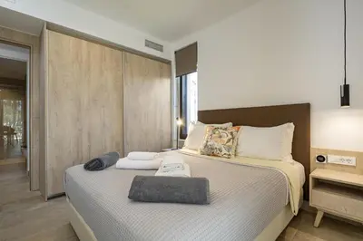 a bedroom with two beds with towels on them at Iniada Villas in Chania Town