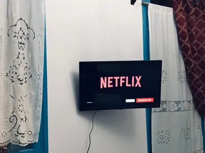 a tv on a wall with the netflix sign on it at DIONI in Chania Town