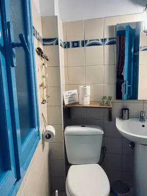 a bathroom with a toilet and a sink at DIONI in Chania Town