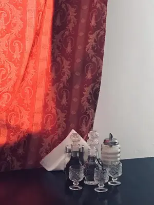 a table with two bottles and glasses on it at DIONI 2 in Chania Town
