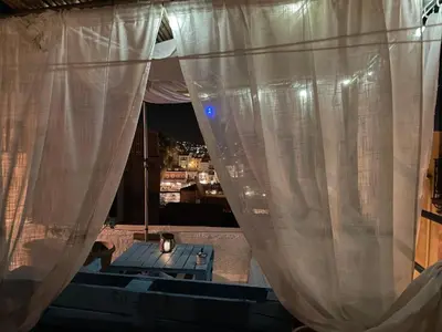 a view of a window with a white curtain at DIONI 2 in Chania Town