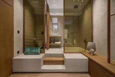 a bathroom with a toilet and a bath tub at Anassa Chania Boutique Hotel in Chania Town