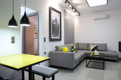 a living room with a couch and a table at Villagio House in Falasarna