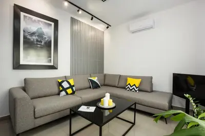 a living room with a couch and a table at Villagio House in Falasarna