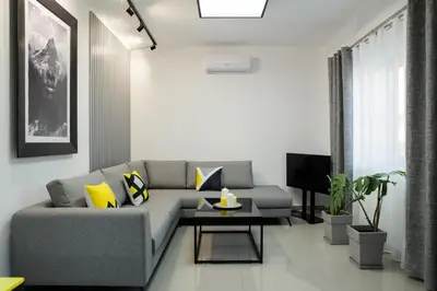 a living room with a couch and a table at Villagio House in Falasarna