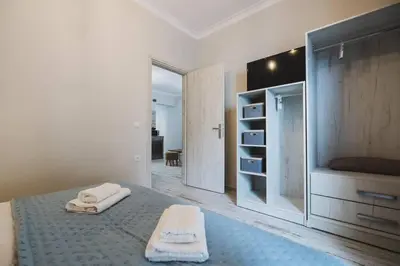 a bedroom with a bed with two towels on it at D&G Lux City Flat next to Old Town and Market in Chania Town