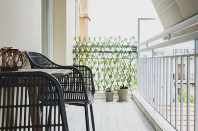 a balcony with two chairs and a table at D&G Lux City Flat next to Old Town and Market in Chania Town
